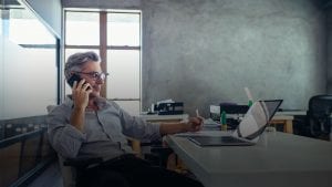 Businessman in office talking on phone