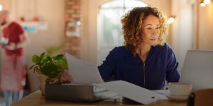 Nurse on the computer paying bills