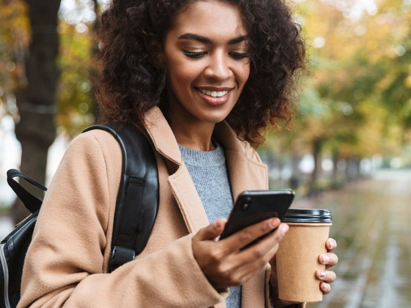 Woman paying mortgage on her phone